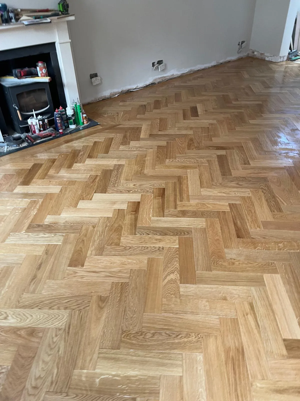 R3 Carpentry parquet flooring installation around a period fireplace