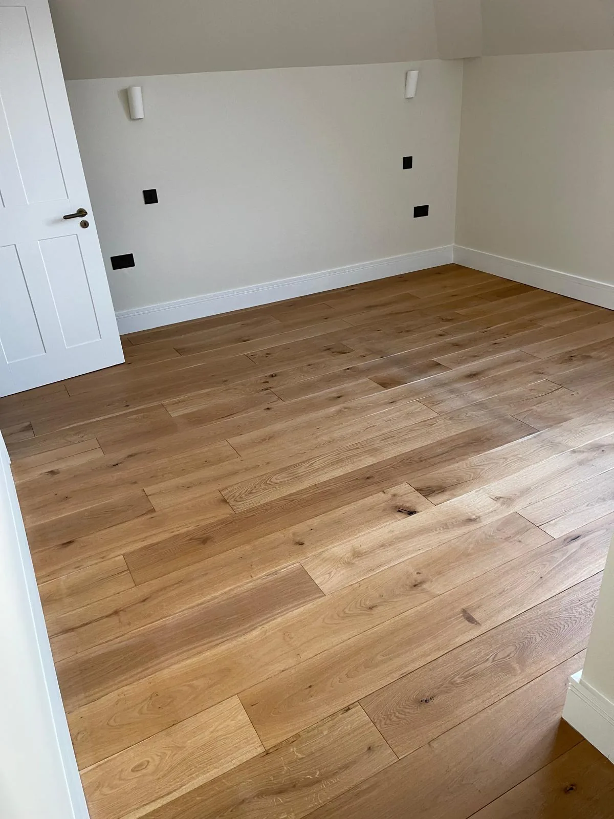 Wide-plank oak flooring fitted by R3 Carpentry